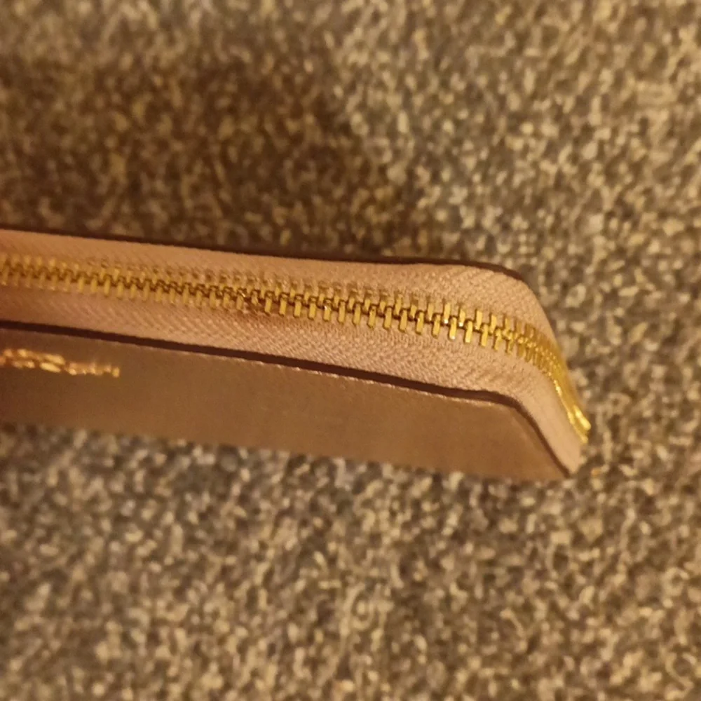 Coach gold pebbled leather accordion wallet